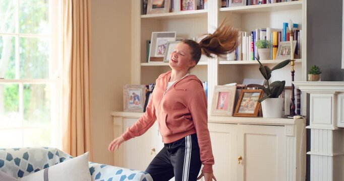 Dancing, weekend and child with music in home for energy, practice and good mood for groove. Moving, dancer and girl with confidence for movement, rhythm and expression with radio in living room