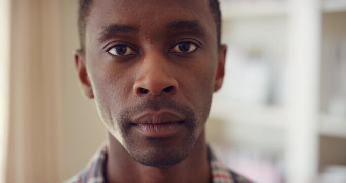Calm, serious and face of man in house with peaceful morning, weekend break or solitude on day off. Chill, black person or quiet afternoon in living room for me time, passive emotion or relax in home