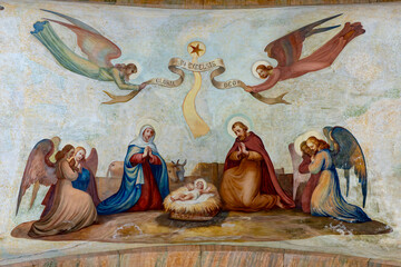 Obraz premium Fresco of Christmas Nativity Scene with Virgin Mary, Saint Joseph, and Jesus baby.
