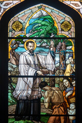 Obraz premium Stained glass of Saint Francis Xavier on mission in China. Saint of the Roman Catholic Church and one of the co-founders of the Society of Jesus.