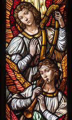 Obraz premium Stained glass of musician angels in heaven.