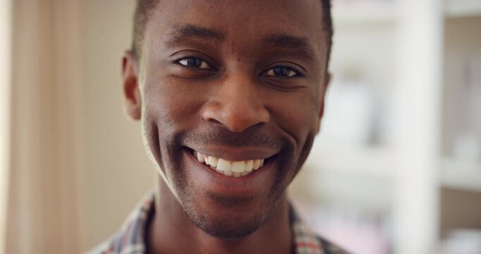 Face, man and happy to relax in home for peaceful morning, weekend break and positive attitude. Laughing, black person and smile in living room for comfortable afternoon, calm day off and wellness