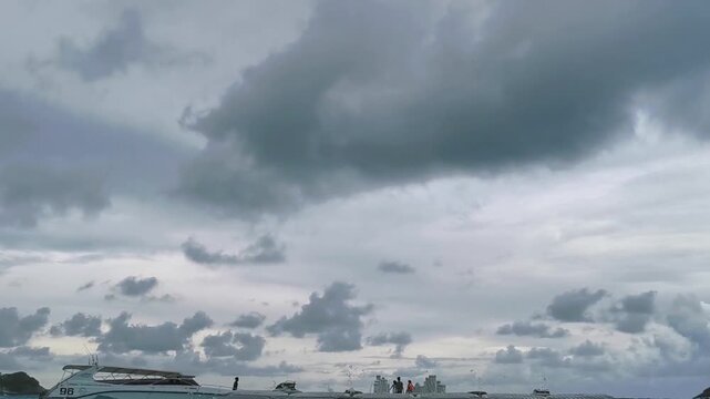 Heavy waves crashing on a floating plastic dock in a tropical sea.