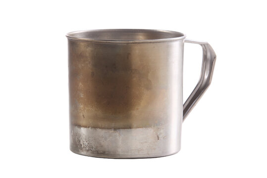 Metal mug shows aged patina and sturdy handle