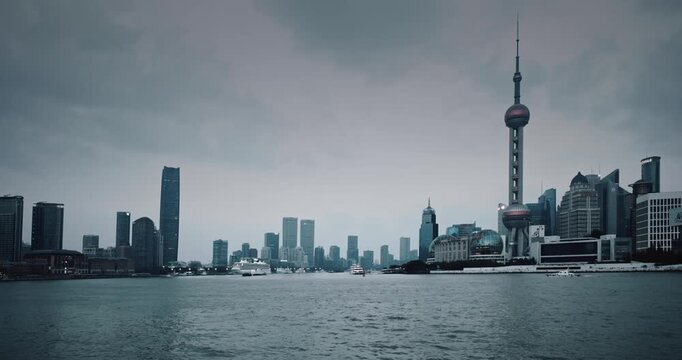 Shanghai, China. large container ship sailing on the Huangpu River framed by Shanghai's