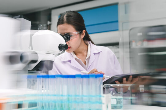Medical biotechnology research laboratory scientist analyzing samples modern environment close-up viewpoint