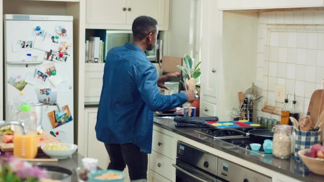 Happy, dancing or black man in kitchen for fun morning, energy or cleaning with vibe in home. Excited, male person or moving with expressive rhythm for audio podcast, radio music or playlist in house
