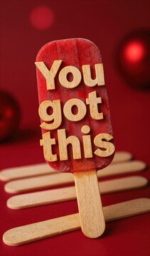 Vibrant Red Popsicle With Phrase Got Inscribed In Bold Golden Letters On Surface Creating Striking Contrast Against Deep Hue Of Ice Treat Mounted