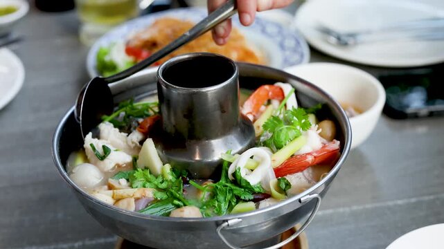 Spicy Thai Tom Yum Seafood Hot Pot with Shrimp and Squid