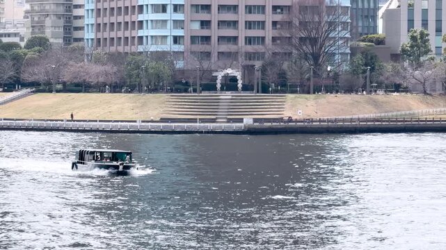 Modern Water Taxi Cruising Along the Sumida River in Tokyo Japan