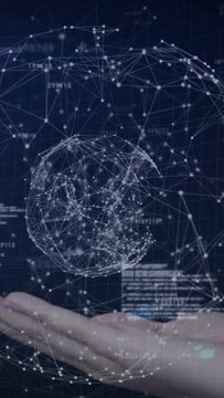 Vertical video: Upon palm entering, wireframe globe forming and rotating above hand to show network