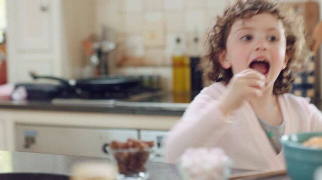 Dance, child and playing with magic wand in home for creative imagination, cookie spell and fun. Energy, happy girl or fantasy toy in kitchen with movement, pretend wizard or cake for development