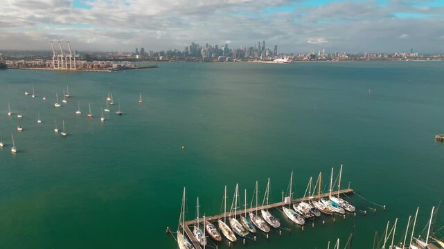 Stunning 4K Drone footage capturing an advance from Gem Pier in Williamstown towards the Melbourne CBD which lies in the far horizon.