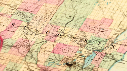 Fototapeta premium Macro View of Vintage Map Highlighting Wisconsin USA with Detailed Geographic Cartography.