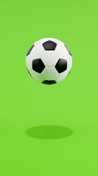 Floating Soccer Ball Spinning on Green Background with Copy Space, Vertical Seamless Loop 3D Animation 