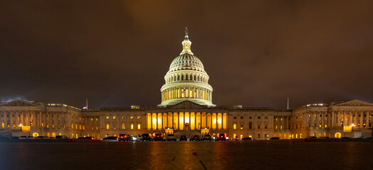 Capitol dome with night lighting. Panorama of the US Capitol. Night view of the Washington Capitol building. Historic Washington DC building. Night cityscape of US Capitol building. © Volodymyr