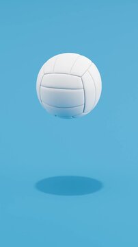 Floating Volleyball Ball Spinning on Blue Background with Copy Space, Vertical Seamless Loop 3D Animation