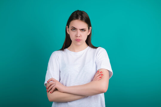 Angry woman shown through posture. Angry expressed by girl face. Angry reflected in attitude. Angry model emotional portrait.