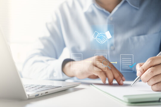 Procurement process management, Digital and paper document approval, contract verification, supplier negotiation, and business purchasing operations using laptop and paper in office environment