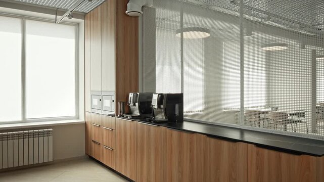 Sunfilled Office Coffee Nook With Stylish Brewing Equipment Overlooking Peaceful Meeting Space