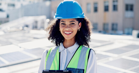 Happy, woman and portrait of contractor by solar panels on rooftop with confidence for sustainable career. Smile, professional and environmental manager by photovoltaic cells with pride for about us. © peopleimages.com