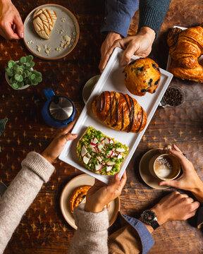 Friends sharing a delicious breakfast platter together