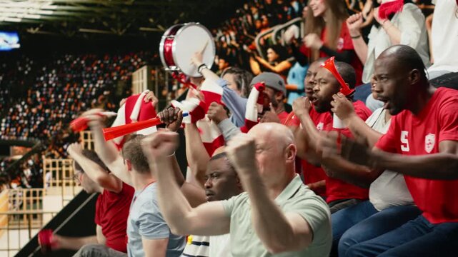 Passionate soccer fans erupting in celebration after winner goal during the final whistle of intense football match with crowd energy and team spirit.