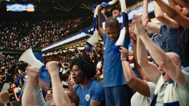 Young soccer fan standing among cheering supporters during live football match, capturing excitement of childhood and sports family.