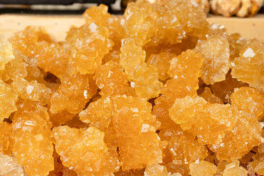 Crystallized rock sugar nabat displayed at Siab bazaar in Samarkand. Traditional Central Asian confection with golden translucent texture, ideal for food and travel content.