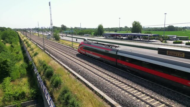 Europe, Italy , Milan 05,28,2026 - Frecciarossa and Italo Hight speed 300km h train railway from Milan  to Turin  view from the drone - the faster way to travel  for tourist and passengers - tourist d