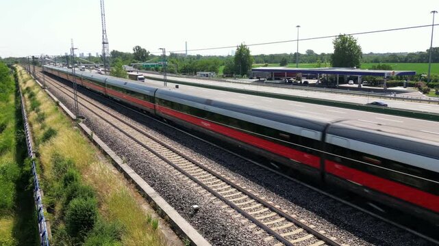 Europe, Italy , Milan 05,28,2026 - Frecciarossa and Italo Hight speed 300km h train railway from Milan  to Turin  view from the drone - the faster way to travel  for tourist and passengers - tourist d