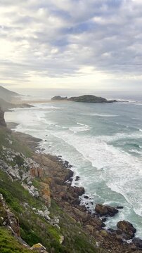 Coastal cliffs on coastline of Robberg peninsula in Plettenberg Bay. Vertical