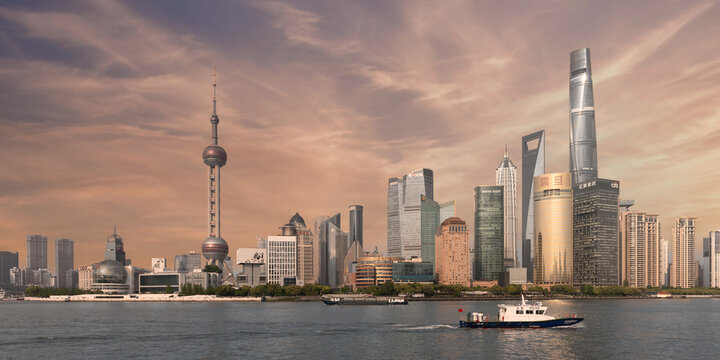 Shanghai, China - May 4, 2026: Pudong skyline with Oriental Pearl TV Tower, Shanghai Tower, SWFC, Jin Mao Tower, and boats on Huangpu River under a cloudy sky