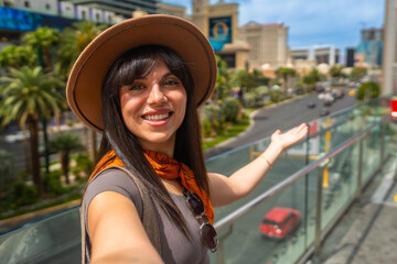 Fototapeta premium Happy woman tourist visiting las vegas city street