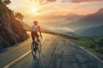 Fototapeta premium Cyclist rides winding road at sunrise