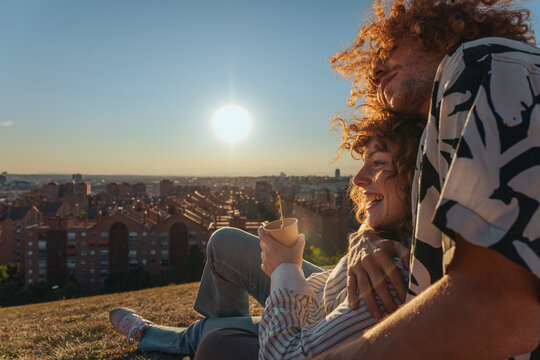 Couple enjoying romantic sunset city view