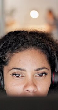 Woman, headset and reading in call center with computer, script review and telemarketing at night. Insurance agent, tech and thinking in agency for claims update, email feedback and overtime business
