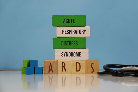 Acute Respiratory Distress Syndrome (ARDS) Concept With Wooden Blocks And Stethoscope On blue Background