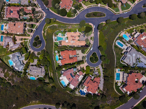 Top down aerial view of luxury residential neighborhood with swimming pools in Newport