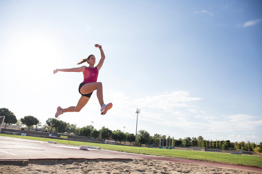 Female long jumper mid-air