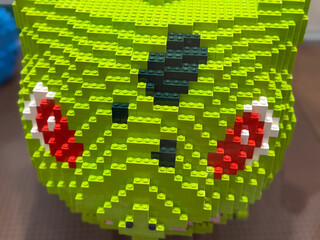 Obraz premium Green block toy face close-up