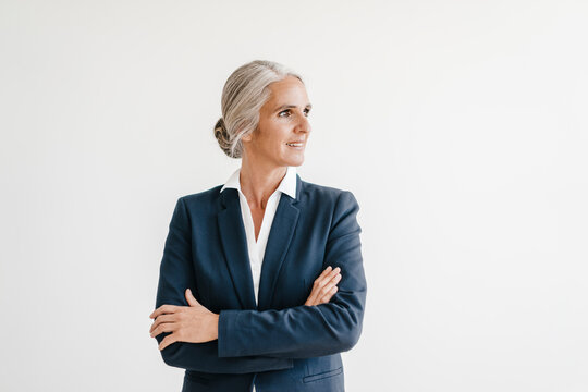 Smiling businesswoman looking sideways
