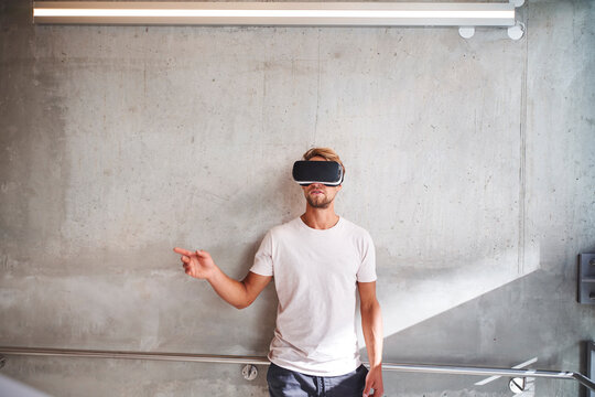 Young man wearing virtual reality goggles