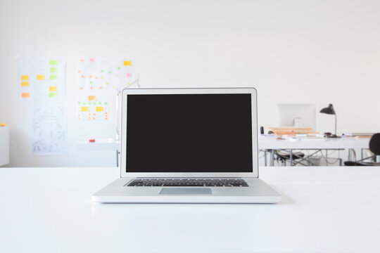 Laptop on desk in office