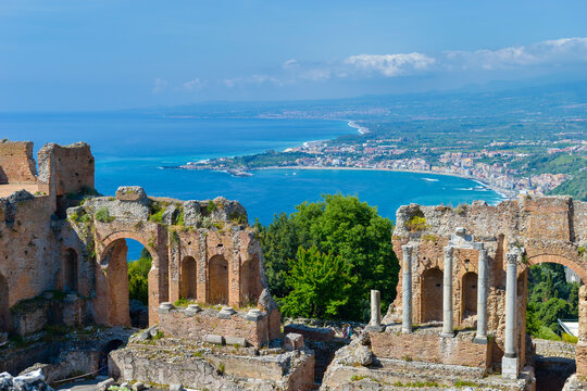 Italy, Sicily, Taormina, Teatro Greco with Giardini Naxos in background