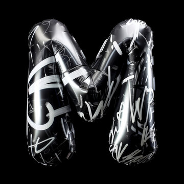 Metallic inflatable balloon shaped as letter M with black and white graffiti style on black background, concept of urban culture