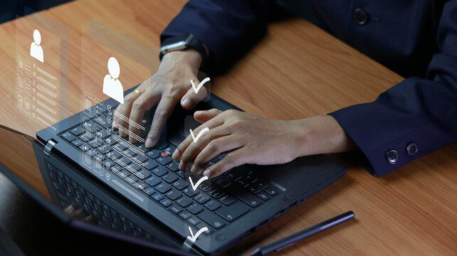 Business professional using laptop with digital checklist and candidate profile interface overlay. Concept of HR recruitment, employee evaluation, workflow approval, and online management.
