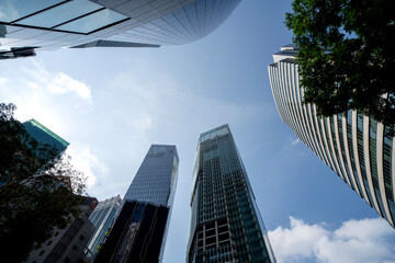 Naklejka premium Singapore CBD skyscrapers towering perspective dramatic upward angle modern financial district