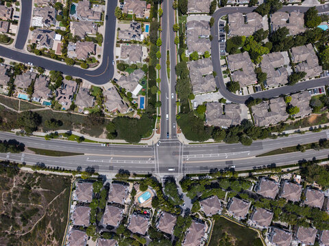 Wide aerial perspective of vast residential community and intersection in Newport
