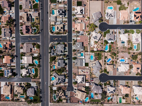 Top down drone shot of desert landscape residential cul-de-sacs and pools